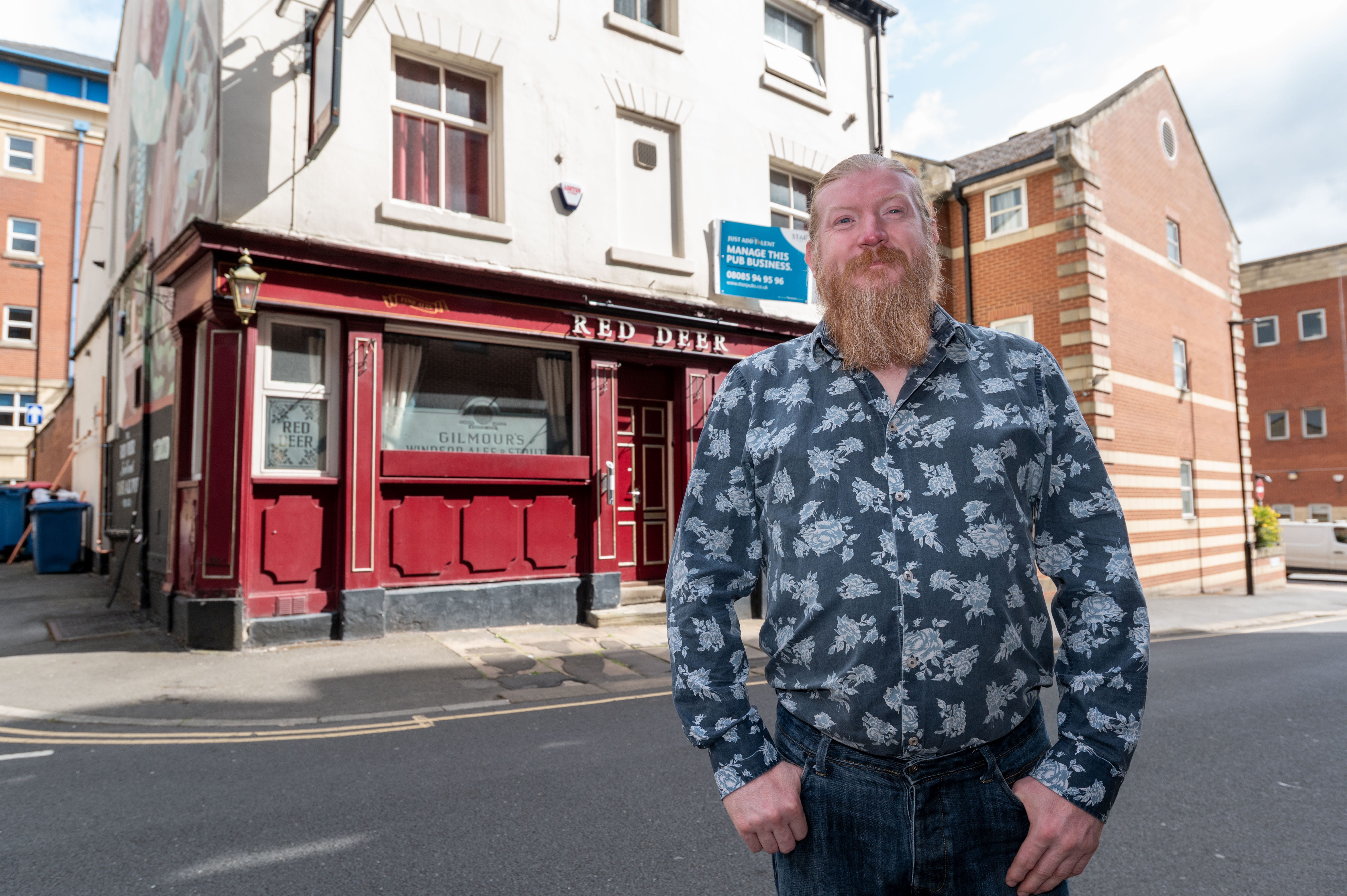 Red Deer Pub in Sheffield with man standing outside smiling