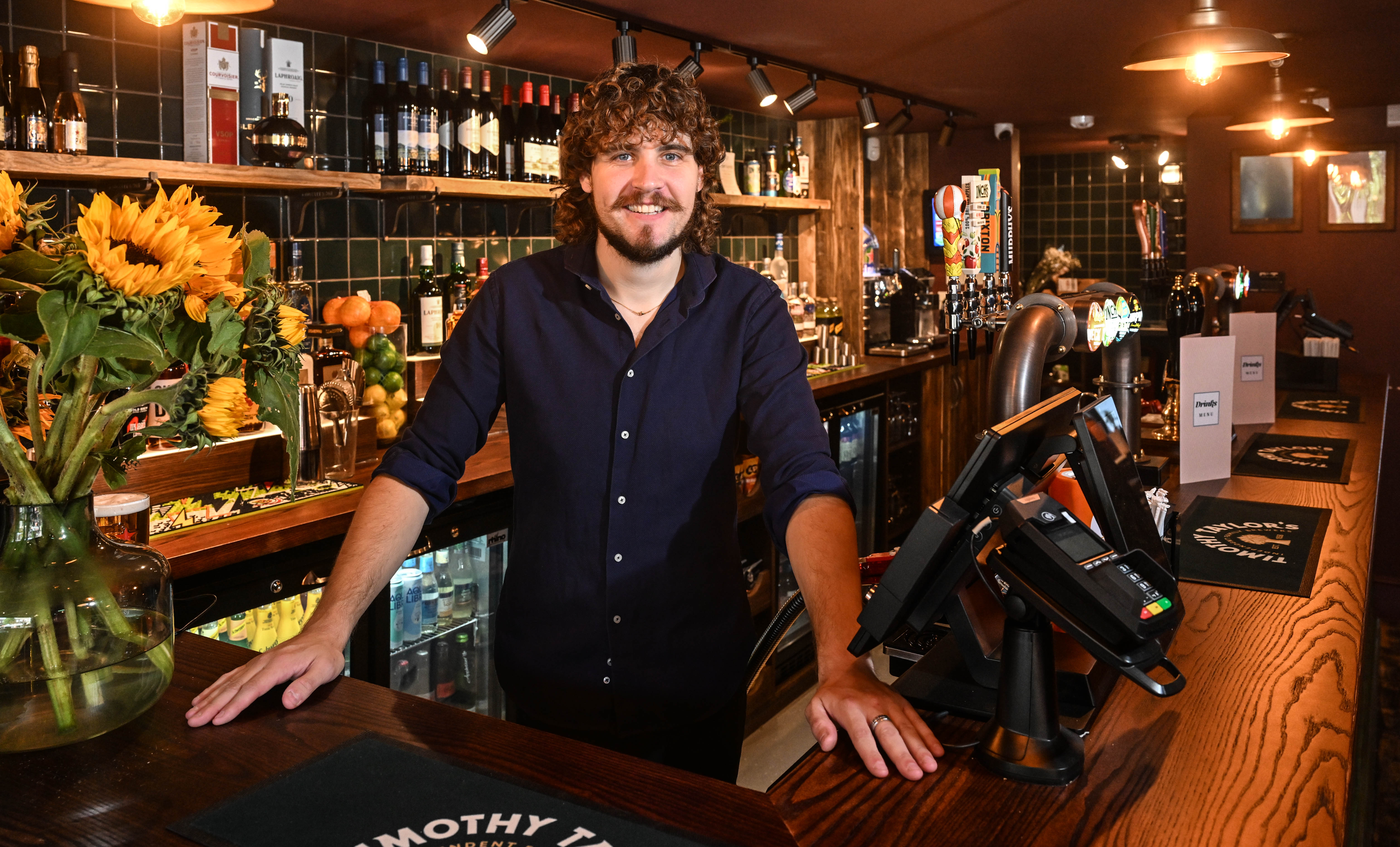 The Engine House operator standing behind the bar