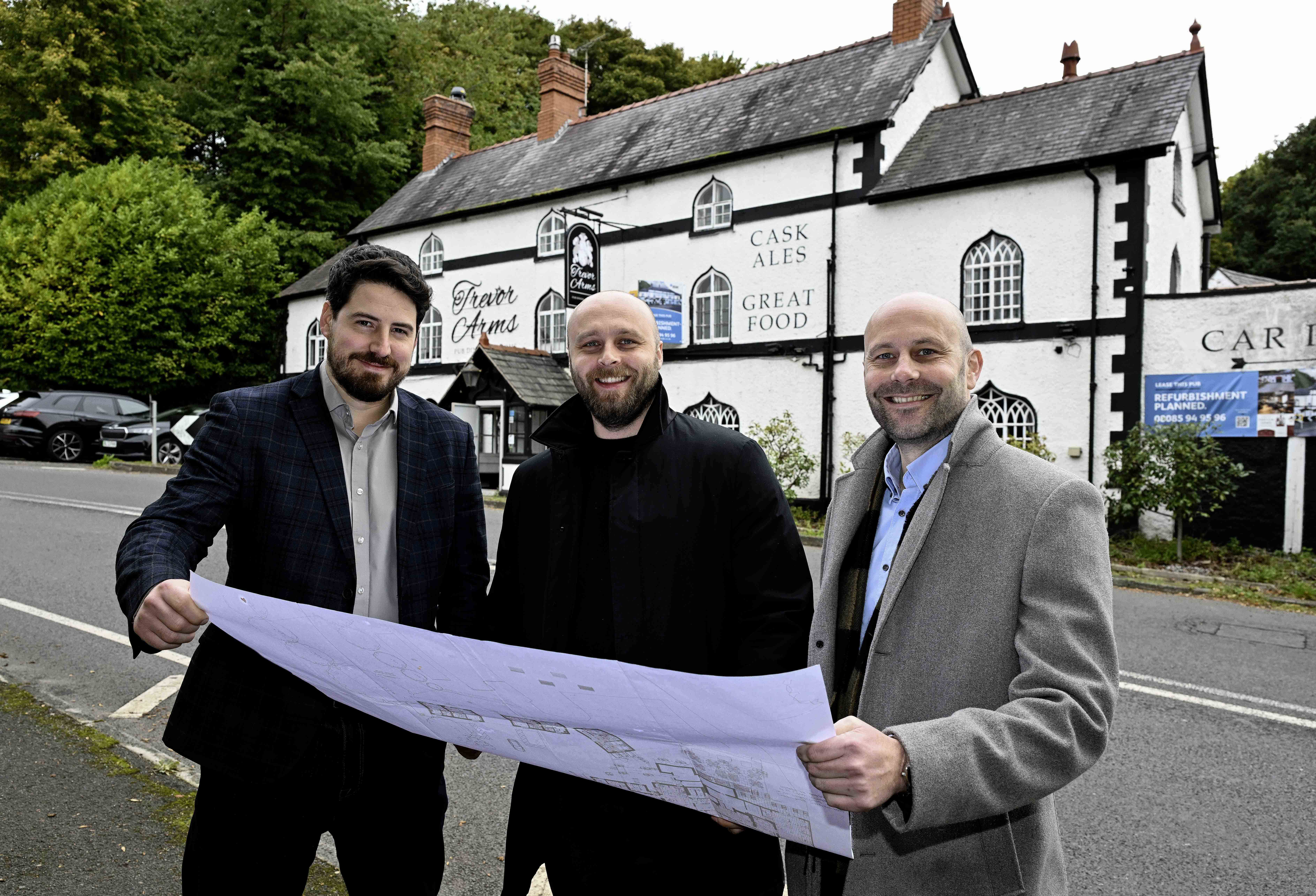 3 men standing outisde of The Trevor Arms