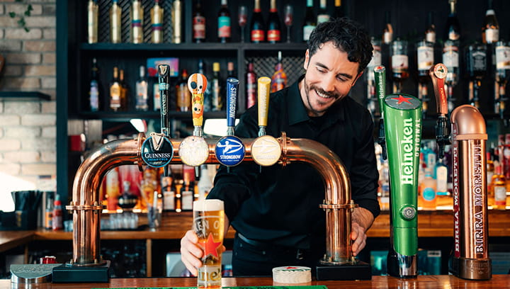 Experienced publican pouring a pint