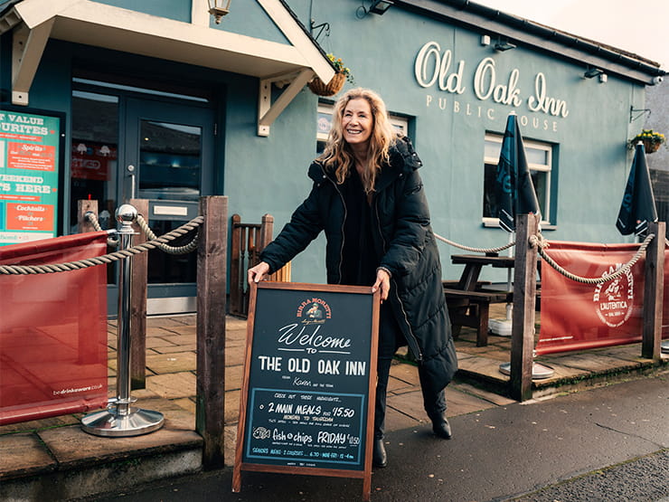 Woman opening up a pub