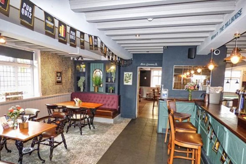 Bar area and seating area with tables