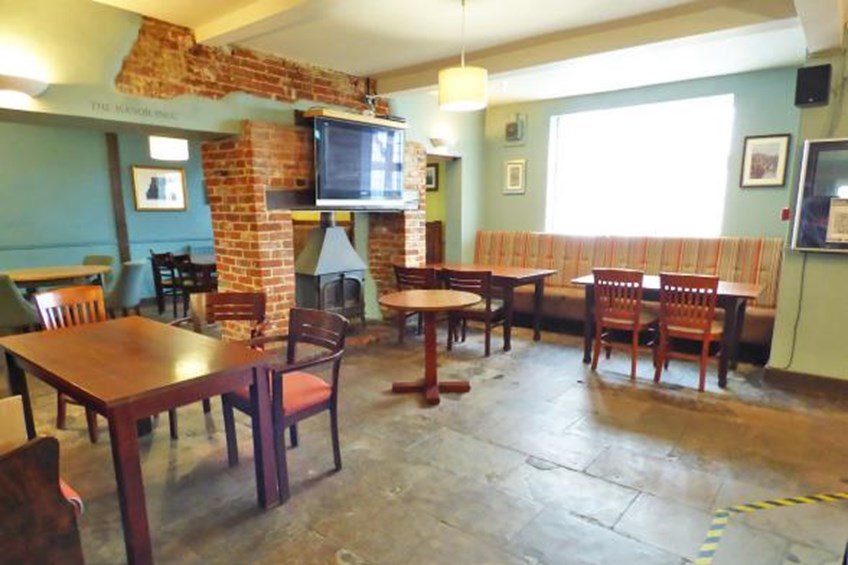 Indoor dining area next to fireplace