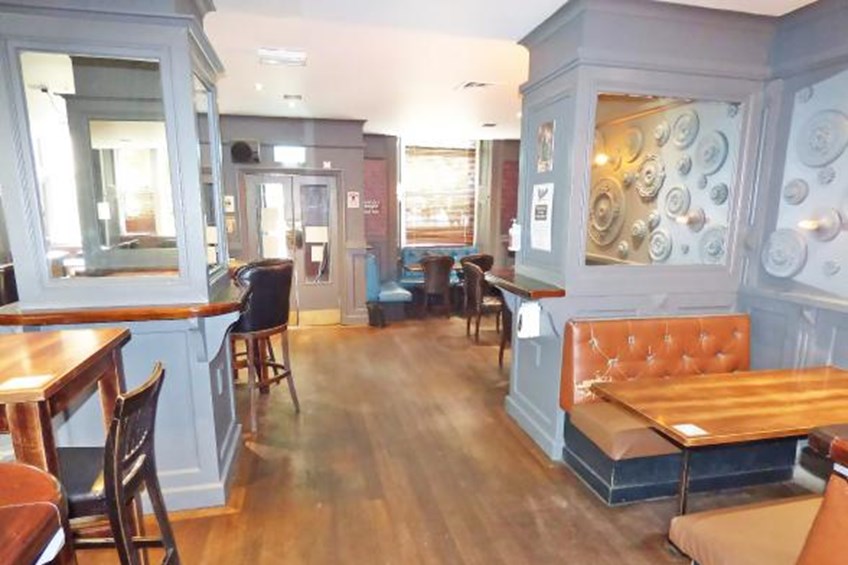 Sitting area with booths and mirrors