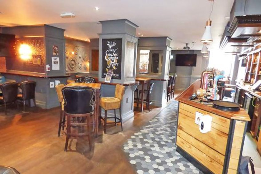Bar area with seating on left