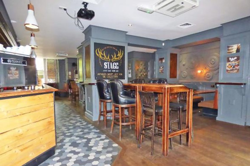Seating area with long high table